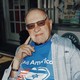 Alan Dershowitz sitting in a rocking chair